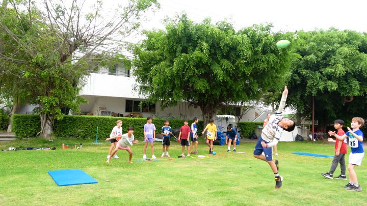 Students participating in the athletics triathlon during the sports day at RIS Swiss Section.